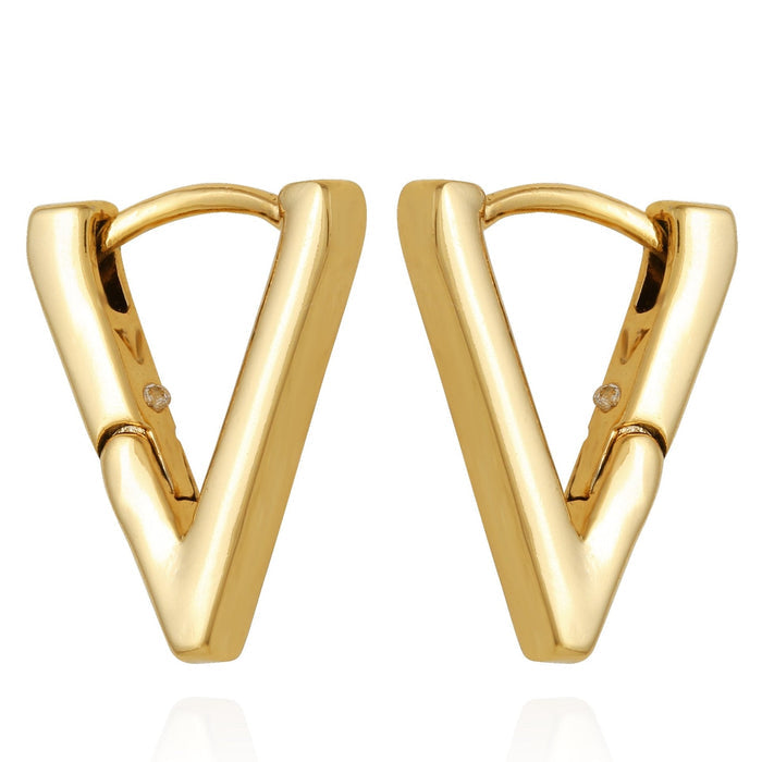A pair of Vince Camuto V-Hinge Huggie Earrings in gold, featuring a small round accent near the top of each earring, displayed on a white background. These minimalistic earrings exude timeless elegance and are perfect for adding a subtle touch of sophistication to any outfit.