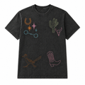 Black vintage wash t-shirt with colorful embroidered designs on a white background