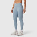 W002 LYCRA® ADAPTIV legging in light sky, worn with white sneakers, side view