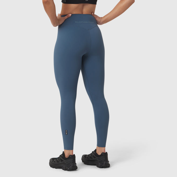W002 LYCRA ADAPTIV Legging in storm blue, worn by model from behind with hands on hips