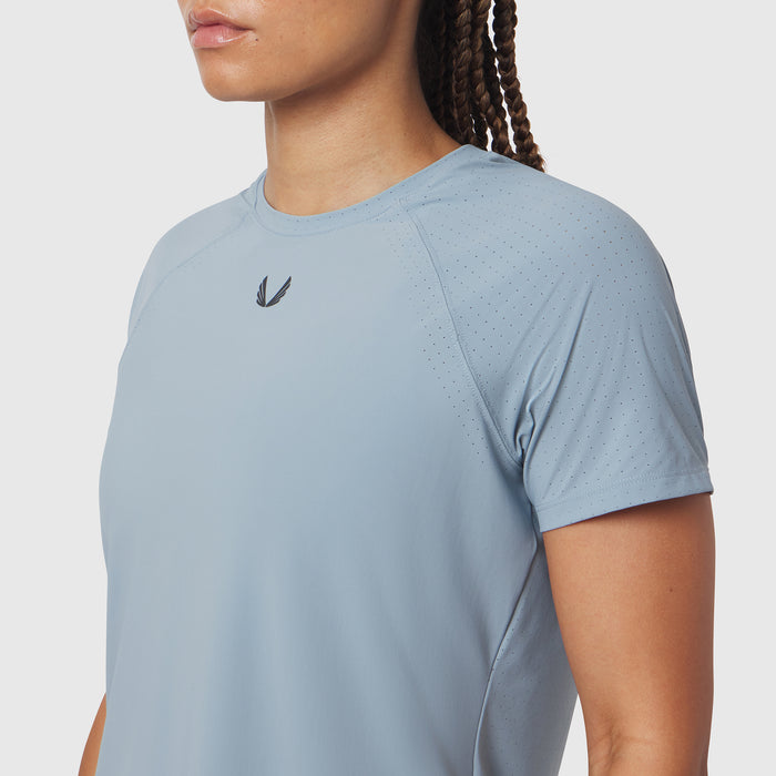 Light Sky Laser-Vent Established Tee worn by model, side view showing perforated fabric detail