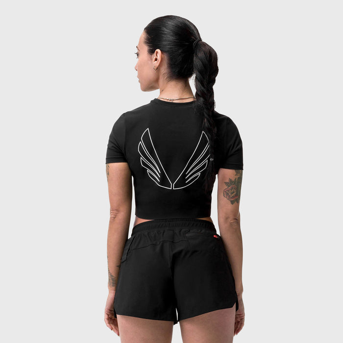 Black cropped tee with white wing graphic on back, worn by model, rear view