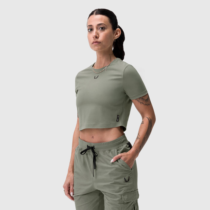 Sage cropped tee worn by model, front view, paired with matching cargo pants