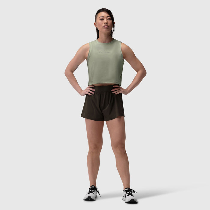 AeroSilver® tank top in sage paired with black shorts, worn by model standing against neutral background