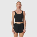 Black LYCRA® 2-in-1 tank top worn by model, front view
