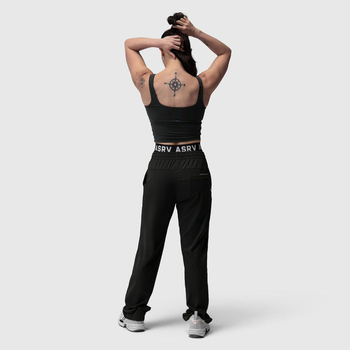 Black LYCRA® 2-in-1 tank top worn by model from back, showing compass tattoo
