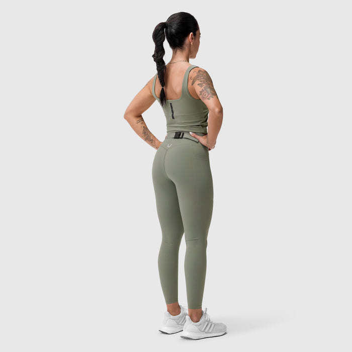 W022 Lycra 2-in-1 tank top in sage, worn by model from behind