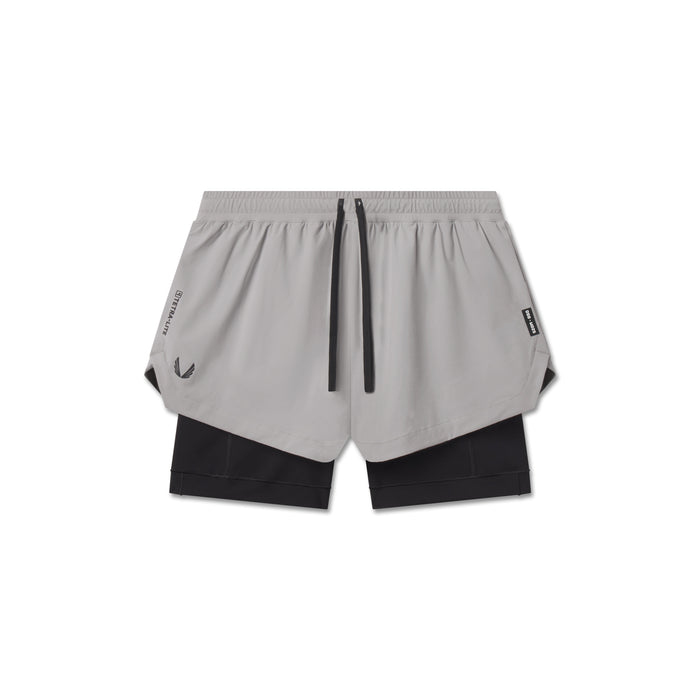 flatlay Tetra-Lite Liner Short in slate grey with black inner shorts, top view