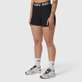 ASRV Lycra Ribbed Short in black, worn with white socks and sneakers, front view