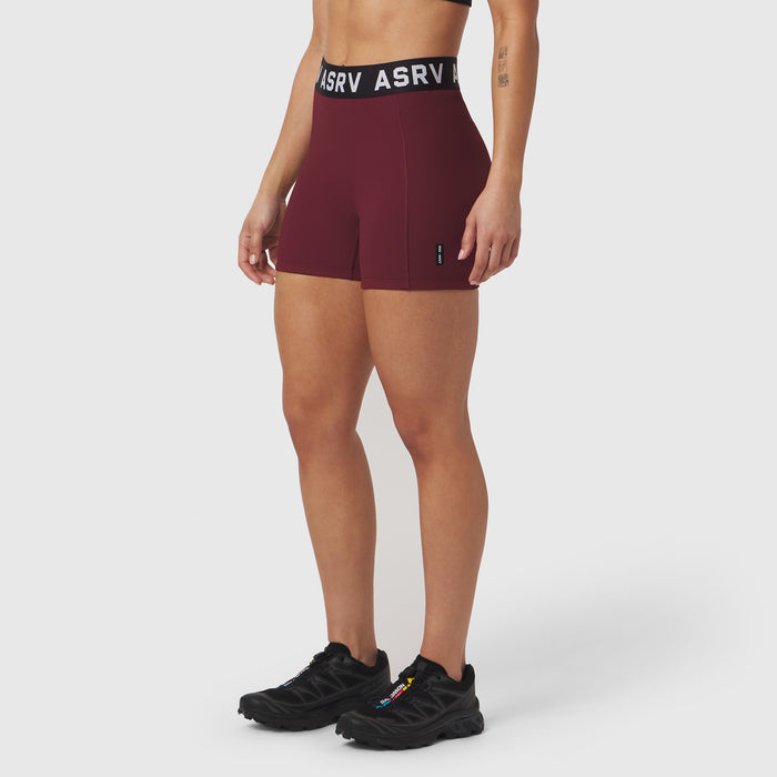 ASRV Lycra Ribbed Short in crimson, worn by model with black sneakers, front view