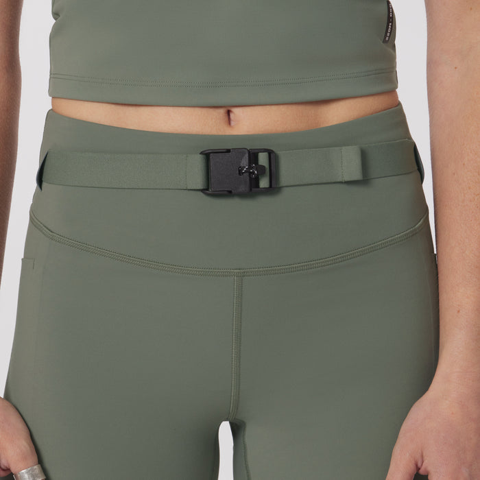 LYCRA® 3-in-1 biker short in sage, worn with matching crop top and belt, front view