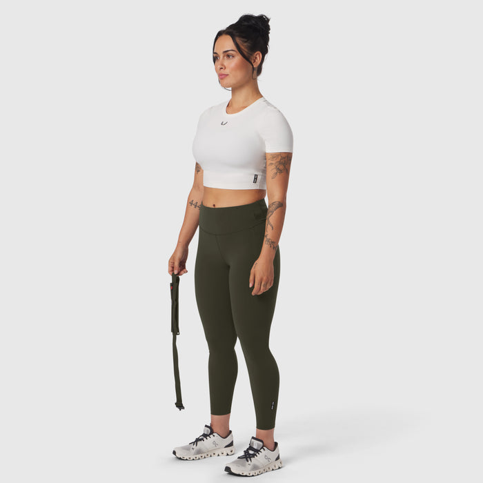 W030 LYCRA® 3-in-1 Legging in olive, model wearing with white crop top and sneakers