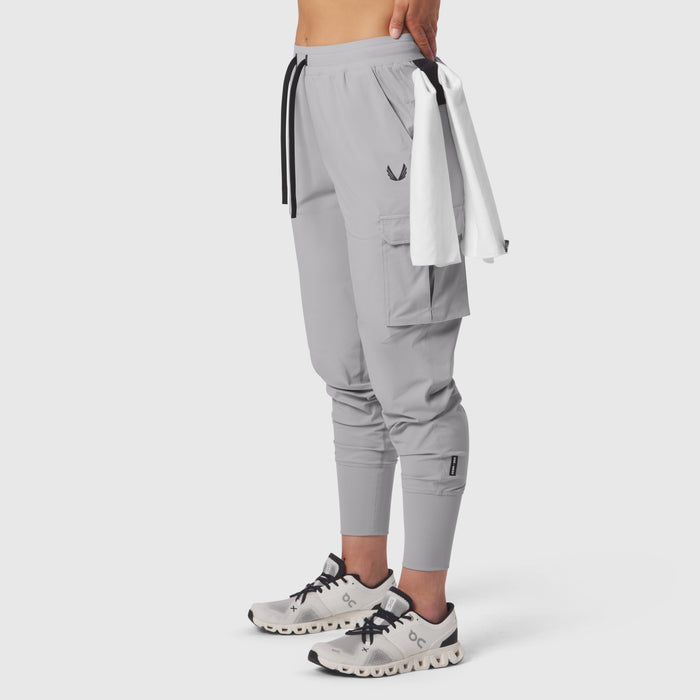 Tetra-Lite Cargo High Rib Jogger in slate grey, worn with towel accessory, side view