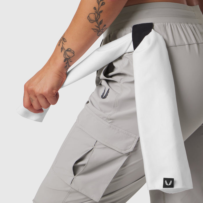 Tetra-Lite® Cargo High Rib Jogger in Slate Grey, worn with white jacket, side view