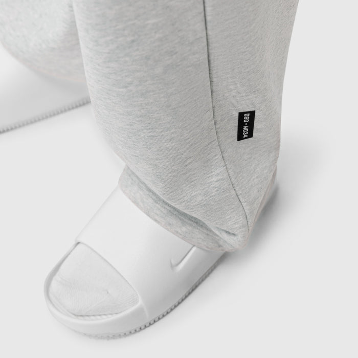 Heather grey Sorona Terry straight leg sweats on model wearing white slides, detail view