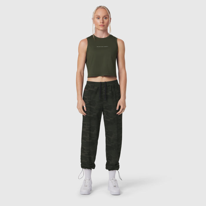 W036 Ripstop Relaxed Track Pant in dark camo, worn with olive crop tank top and white sneakers