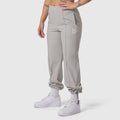 W036 Ripstop Relaxed Track Pant in slate grey, worn with white socks and sneakers, front view