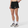 W037 Tetra-Lite Linerless Short in black with bracket design, worn with white socks and beige sneakers