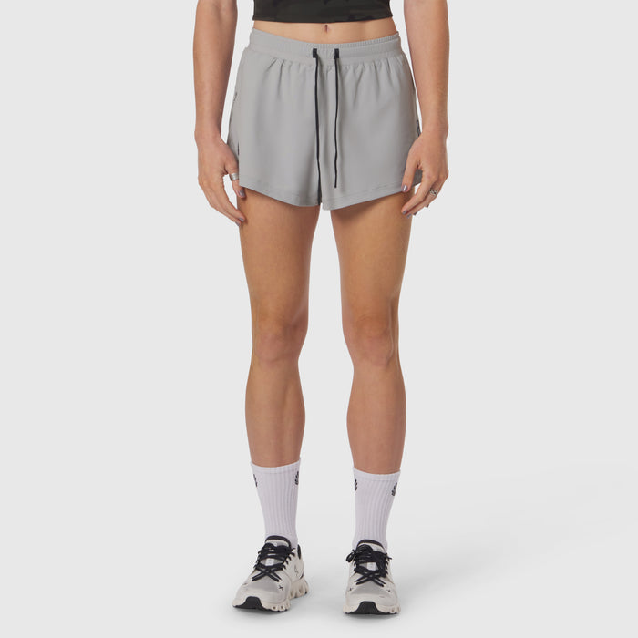 Tetra-Lite Linerless Short in slate grey, worn with white socks and sneakers, front view