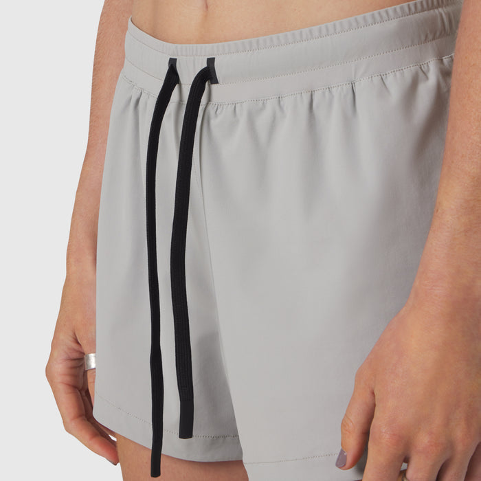 Tetra-Lite Linerless Short in slate grey worn by model, front view with drawstring detail