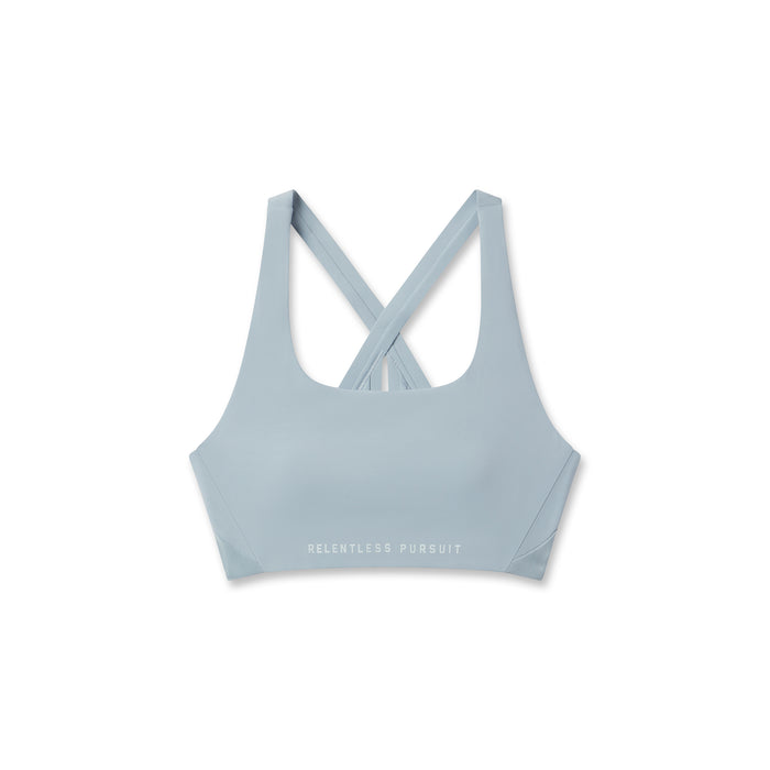 Flatlay of W039 Lycra Hybrid Sports Bra in light sky, front view with crossback straps