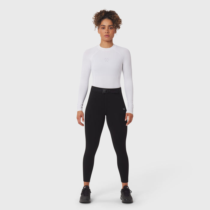 LYCRA® ADAPTIV Baselayer Longsleeve in white, worn with black leggings, front view on model