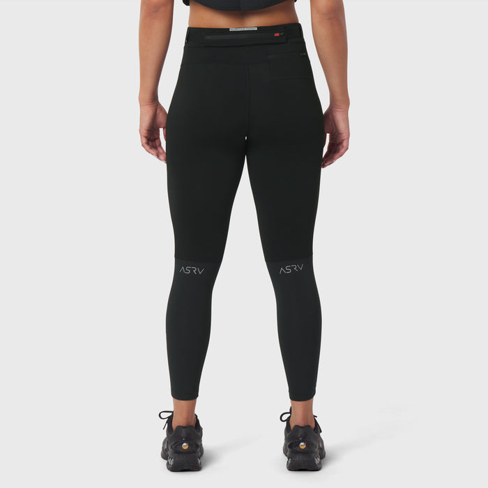 W059 Hybrid Belt-Pack Run Legging in black, back view on model with hiking boots