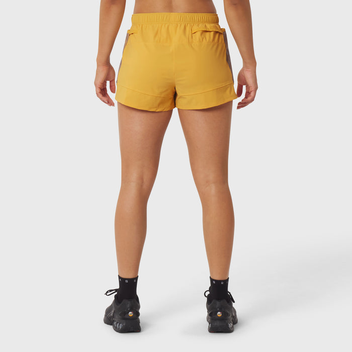 Tetra-Lite Adventure Short in amber, rear view on model wearing black socks and shoes