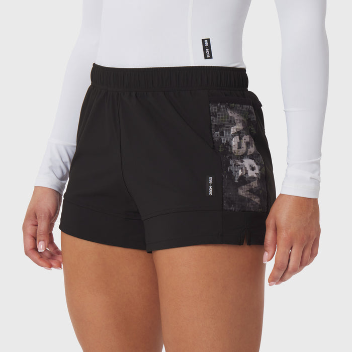 Tetra-Lite Adventure Short in black worn by model, front view showing mesh side panel detail
