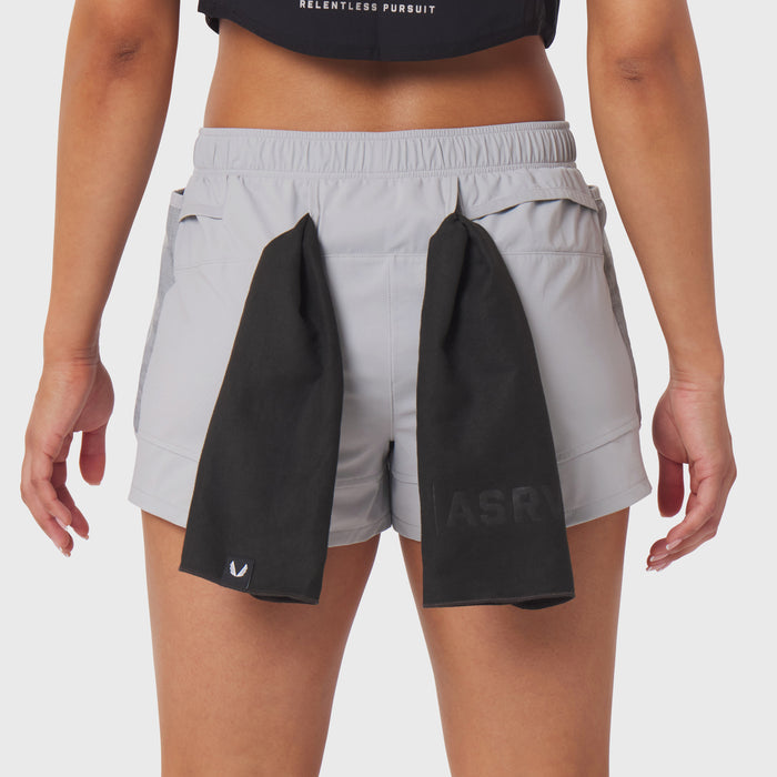 Tetra-Lite Adventure Short in slate grey worn by model, back view with black towel