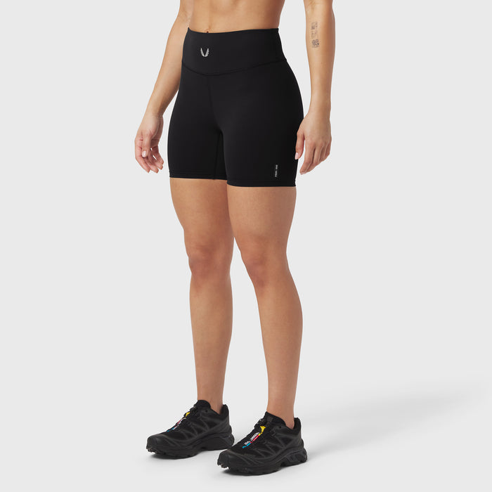 Black LYCRA® ADAPTIV biker shorts worn by model, front view