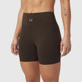 LYCRA® ADAPTIV Biker Short in dark earth worn by model, front view