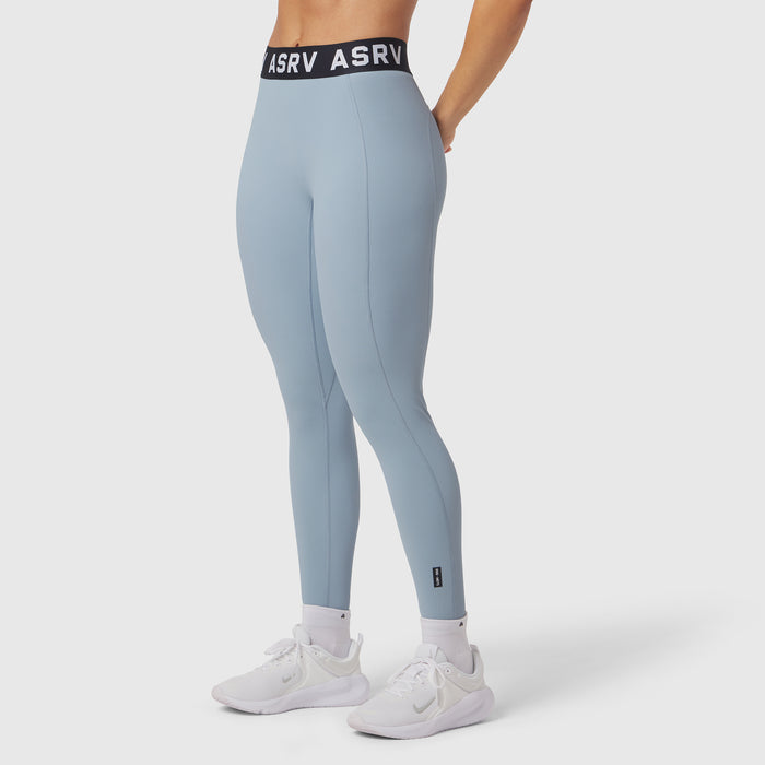 W071 Lycra Ribbed Legging in light sky, worn with white sneakers, side view