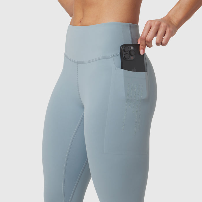 Light sky 4 pocket legging worn by model, demonstrating phone pocket functionality