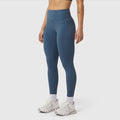 W072 LYCRA® ADAPTIV 4 Pocket Legging in Storm blue, modeled from waist down with white sneakers