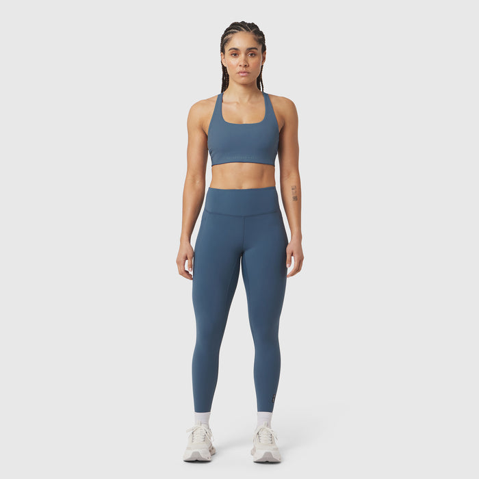W072 LYCRA® ADAPTIV 4 Pocket Legging in storm blue, worn by model standing facing camera