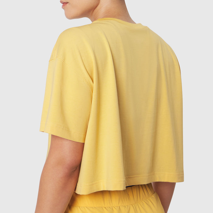 W082 Supima Ice-Skin Reversible Crop Tee in Amber worn by model, back view