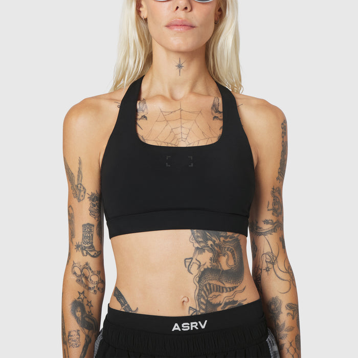 W096 LYCRA® ADAPTIV Racerback Sports Bra in black, front view on model