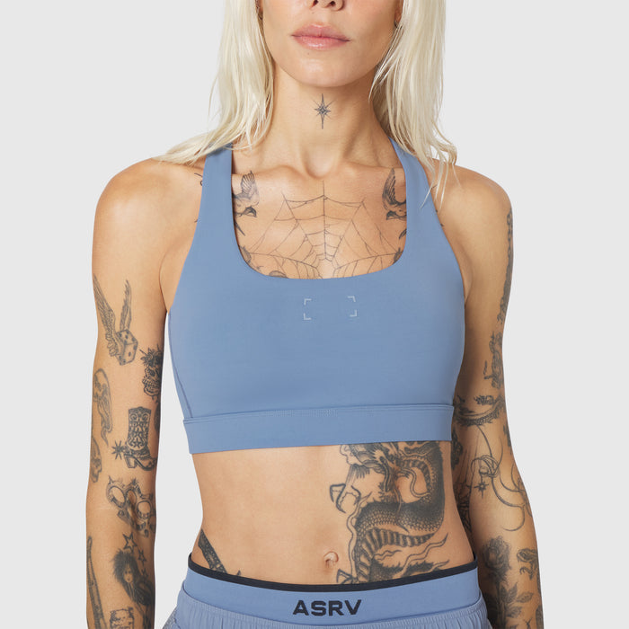 W096 LYCRA® ADAPTIV Racerback Sports Bra in Slate Blue, front view on model