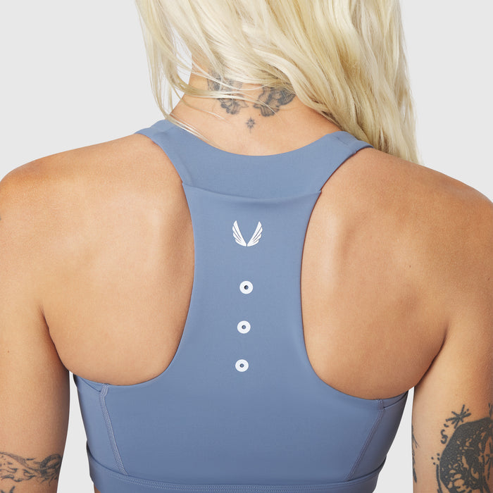 W096 LYCRA® ADAPTIV Racerback Sports Bra in Slate Blue, back view on model