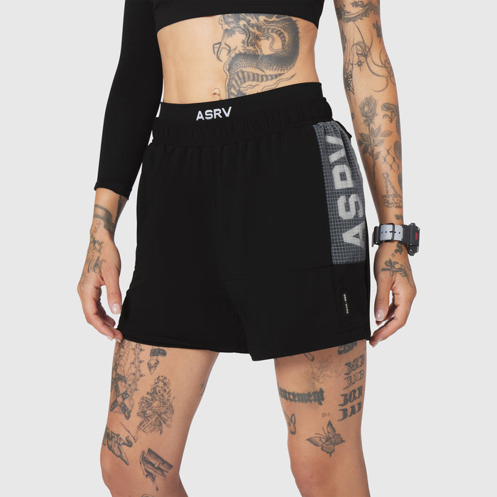 W100 2-in-1 convertible shorts in black, front view on model