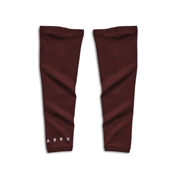 flatlay WarpFlexx® Leg Sleeves in crimson, pair displayed on white background