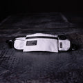 flatlay WN'18 Training Belt Pack in white and black, top view