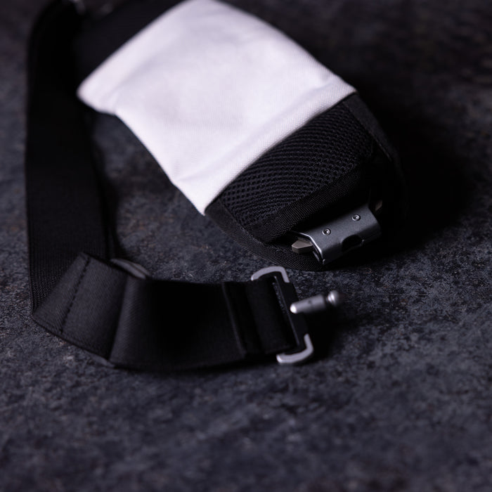 flatlay WN'18 Training Belt Pack in black with white interior pocket, overhead view