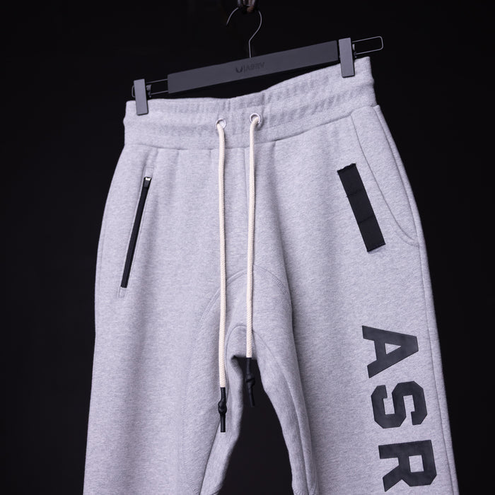 WN'19 RainPlus® Jogger in light grey, displayed on hanger showing side view with branding