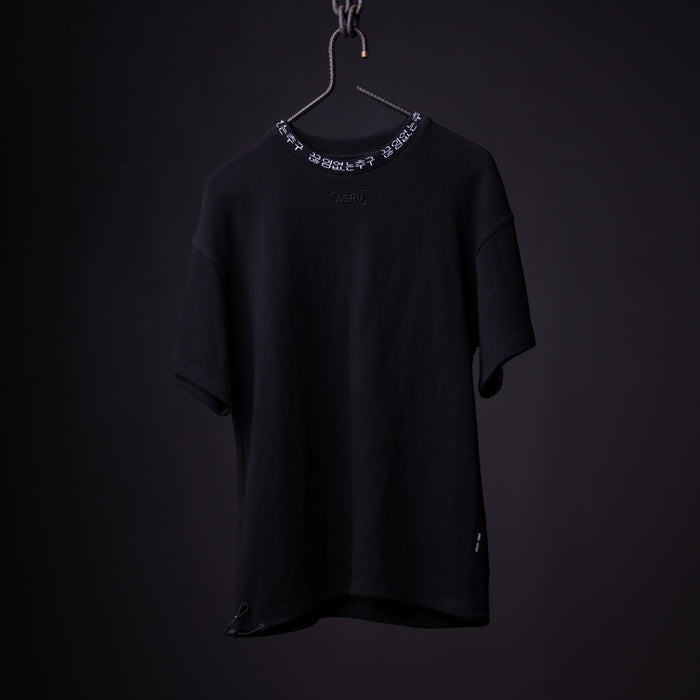 Black oversized cinch tee on hanger with decorative chain neckline detail, front view