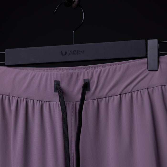 WN'23 Cyber Tech High Rib Jogger in mauve hung on black hanger, front detail view