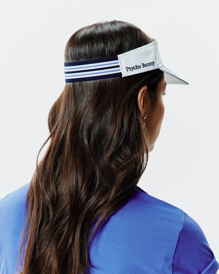 Women's Sport Visor featuring a crisp white brim, a navy blue elastic band with prominent light blue and white stripes, and an embroidered Psycho Bunny text logo on the front panel.