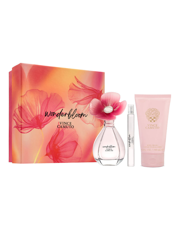 The Vince Camuto Wonderbloom 3-Piece Set includes a pink floral box, a flower-topped perfume with pear leaves and white freesia notes, a travel spray, and a pink tube of body lotion.
