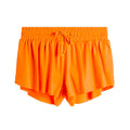 Orange girls' sizing flowy shorts with elastic waistband, front drawstring tie, and layered hem detail.